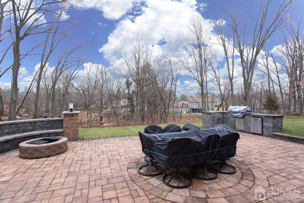 18 Layne Road Somerset, NJ 08873 - Photo 22 of 22 a backyard of a house with table and chairs