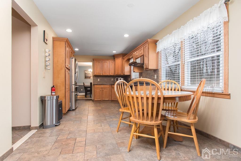 18 Layne Road Somerset, NJ 08873 - Photo 7 of 22 a view of a dining room with furniture window and outside view