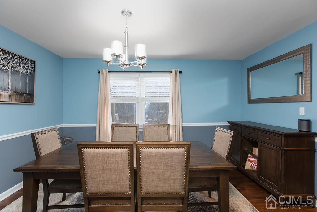 18 Layne Road Somerset, NJ 08873 - Photo 8 of 22 a view of a dining room with furniture window and wooden floor