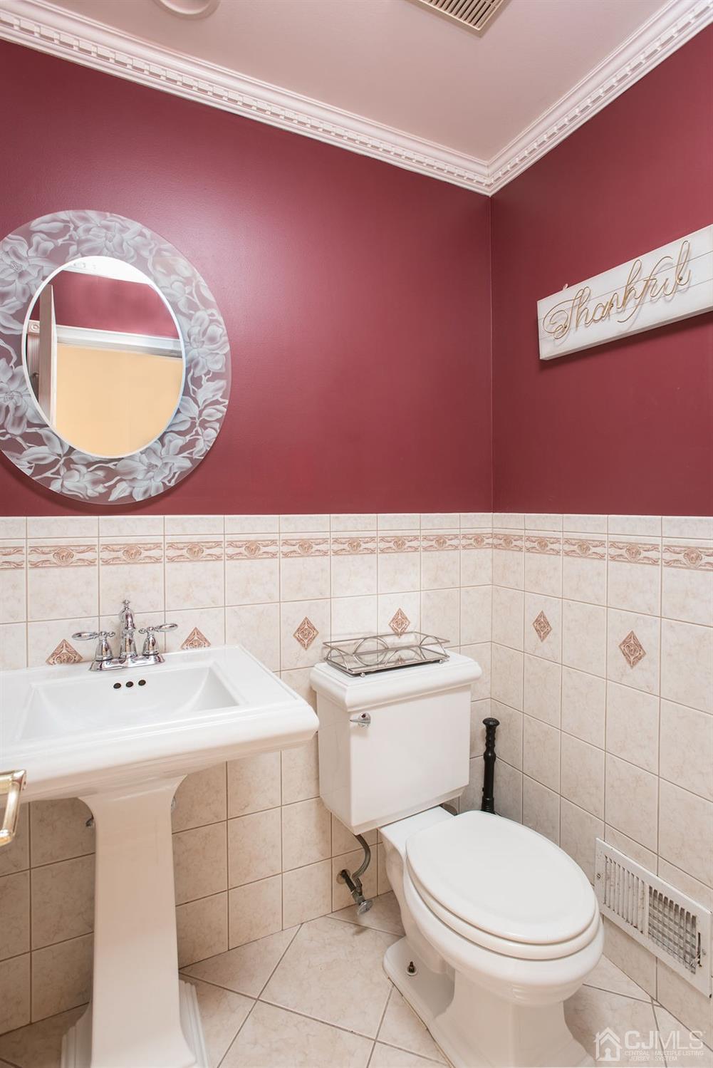 18 Layne Road Somerset, NJ 08873 - Photo 10 of 22 a bathroom with a sink mirror vanity and toilet