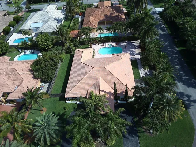 an aerial view of house with yard and outdoor space