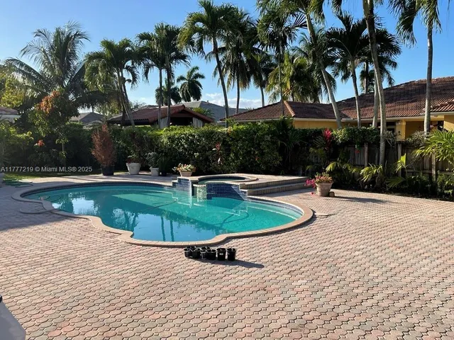 a view of a swimming pool with a patio
