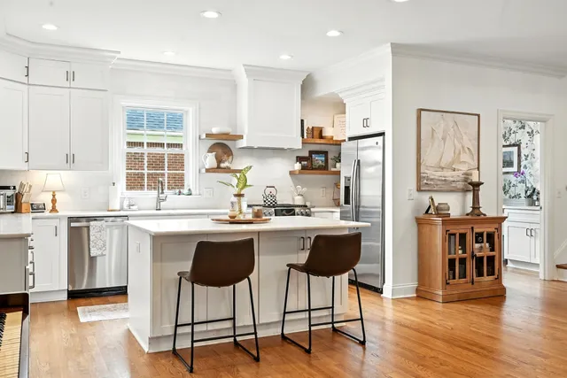 a living room with furniture or couch and a wooden floor