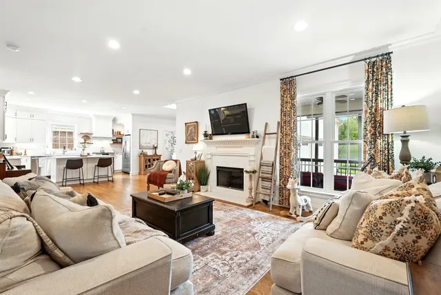 a view of balcony with wooden floor and seating space