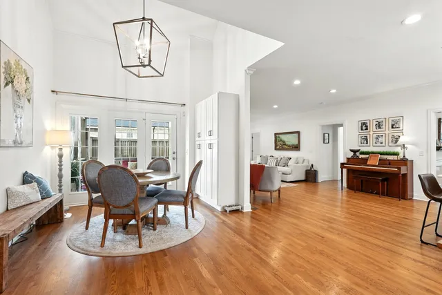 a spacious bedroom with a bed and a flat screen tv