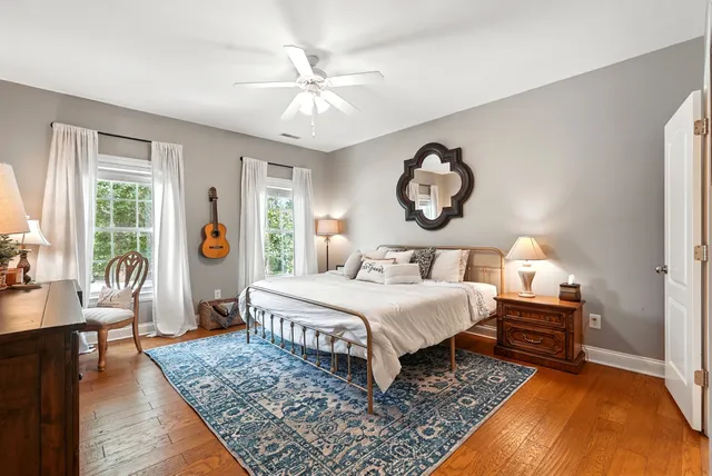 a spacious en suite bathroom with a double vanity sink and a mirror