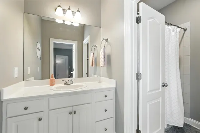 a view of a garage with rack and bicycle