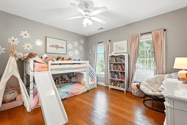 an aerial view of a house with garden space and street view