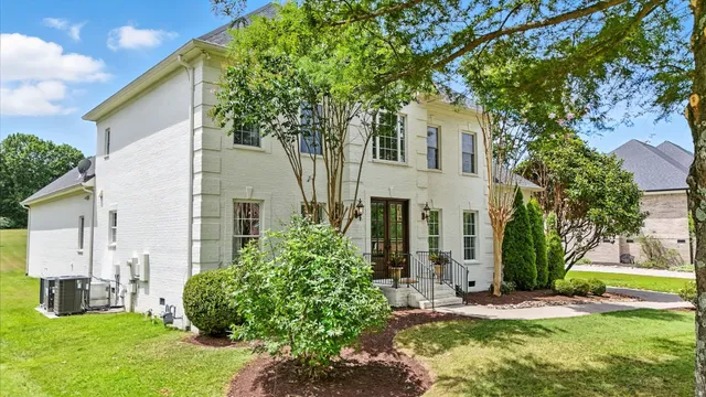 an aerial view of a house with a garden