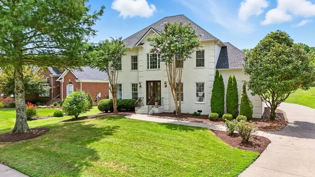 an aerial view of residential house with yard swimming pool and outdoor seating
