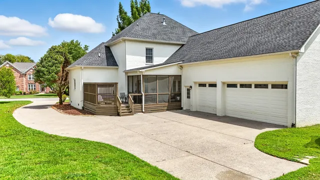 an aerial view of a house with a garden and swimming pool
