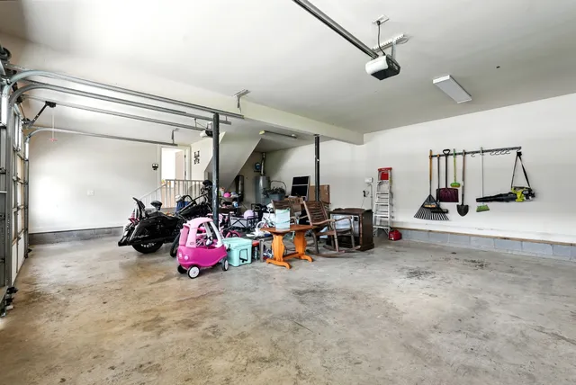 an aerial view of a house with a garden and swimming pool
