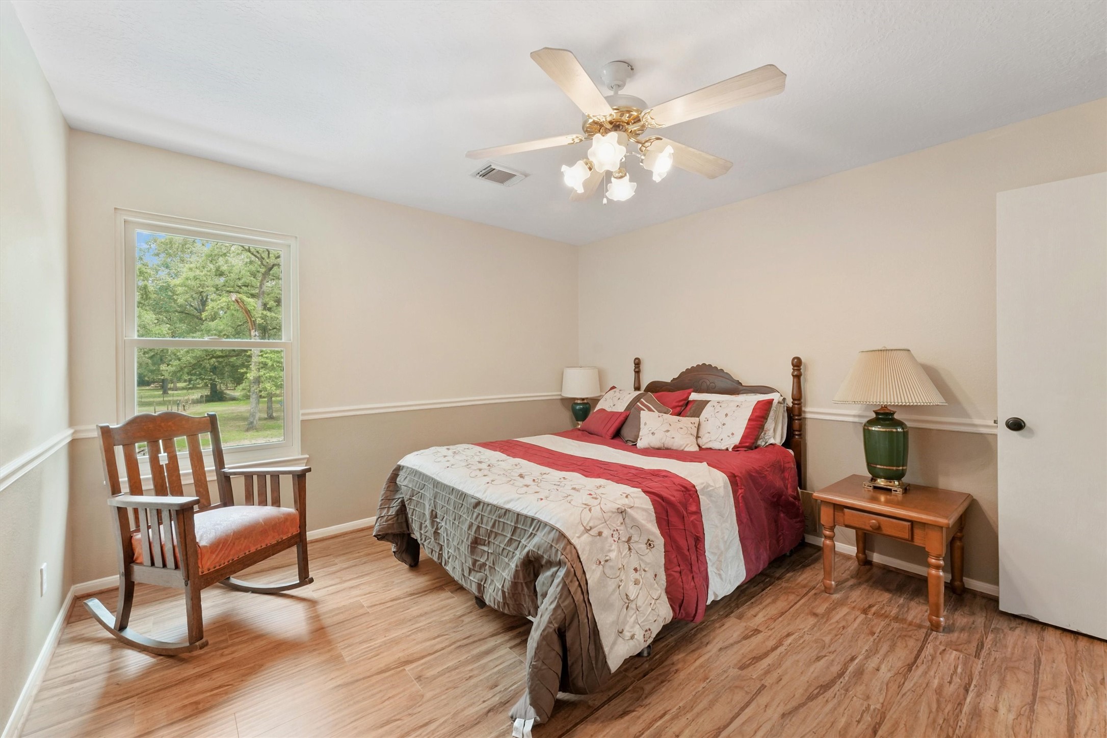 6803 Treaschwig Road Spring, TX 77373 - Photo 12 of 22 a bed room with a bed and a chair