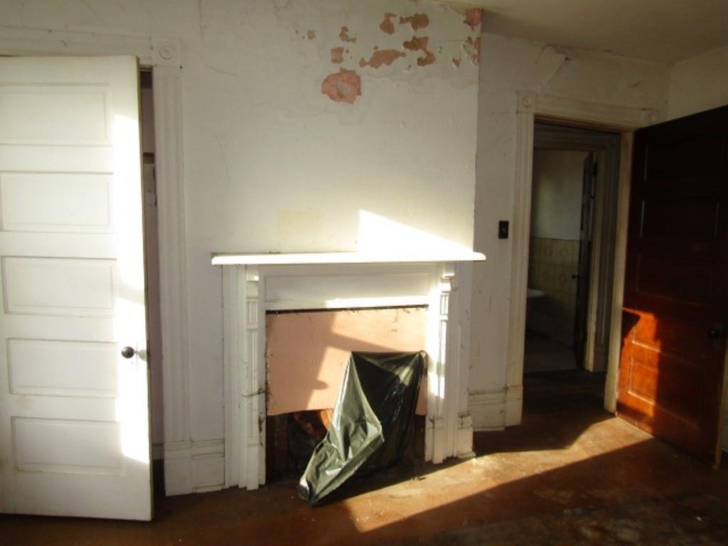 1219 Tweed Street Pittsburgh, PA 15204 - Photo 23 of 30 a bedroom with a bed and a mirror