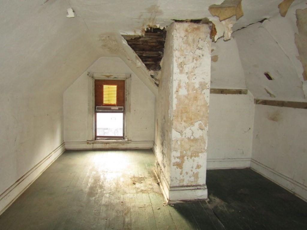 1219 Tweed Street Pittsburgh, PA 15204 - Photo 28 of 30 a view of a hallway with wooden floor and a bathroom