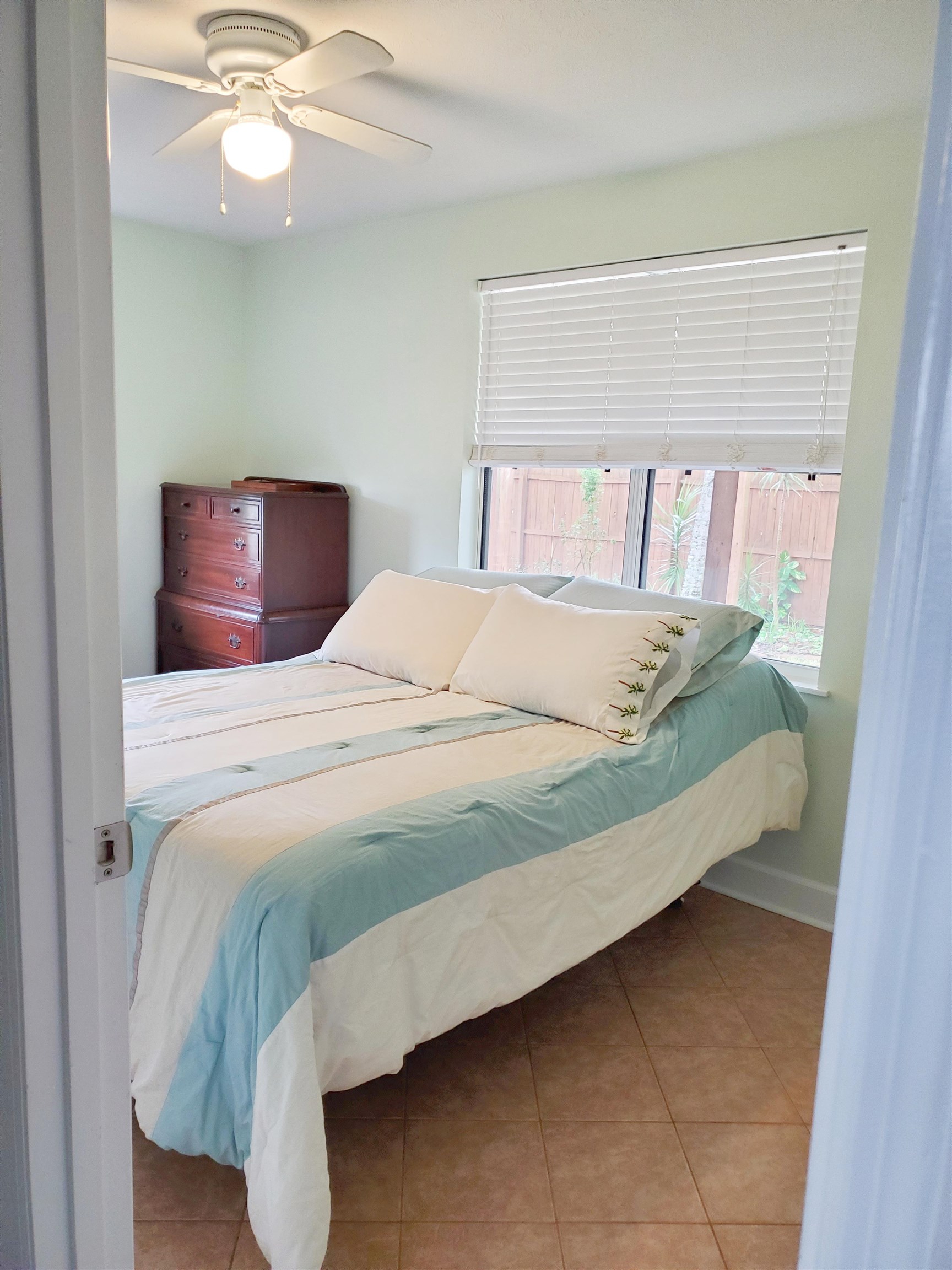 237 Villa Verda Road St. Augustine, FL 32080 - Photo 33 of 48 a large bed sitting in a bedroom next to a window
