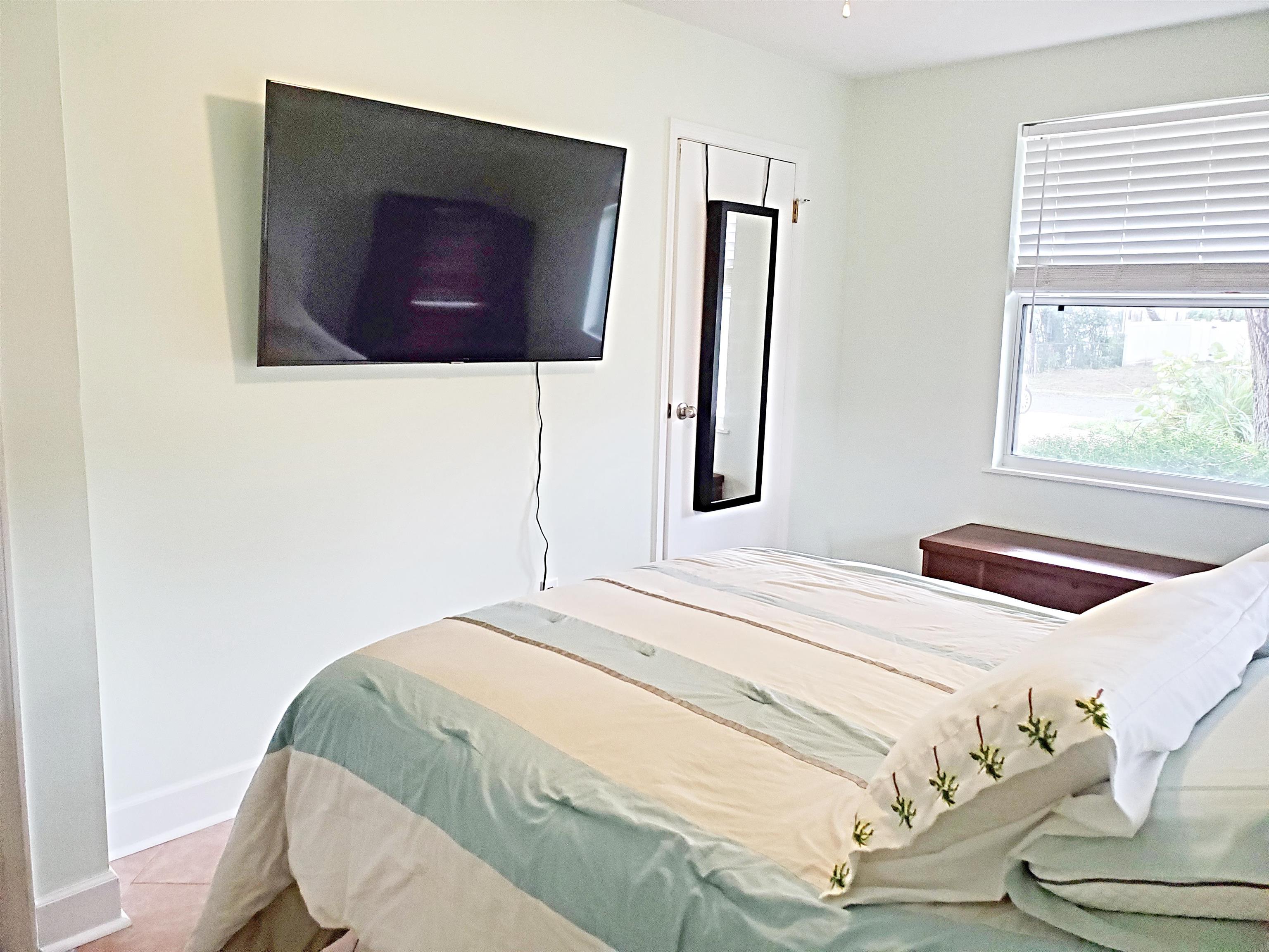237 Villa Verda Road St. Augustine, FL 32080 - Photo 34 of 48 a bedroom with a bed and a flat screen tv