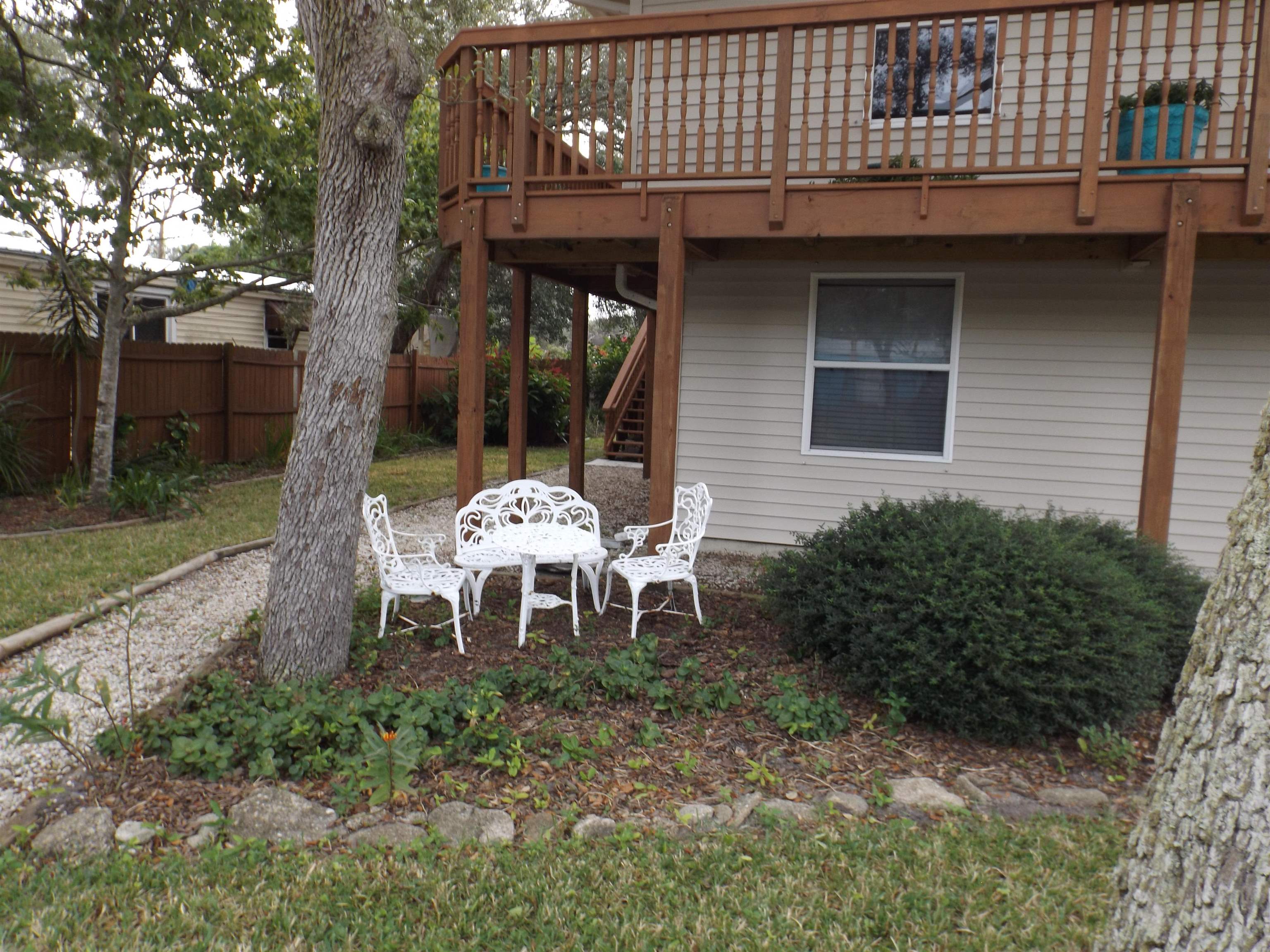 237 Villa Verda Road St. Augustine, FL 32080 - Photo 5 of 48 a front view of a house with table and chairs