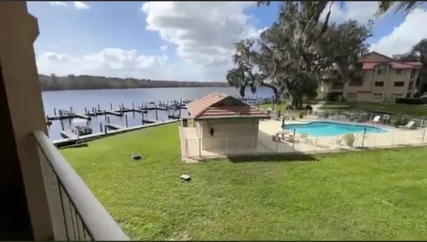 a view of a swimming pool with a yard