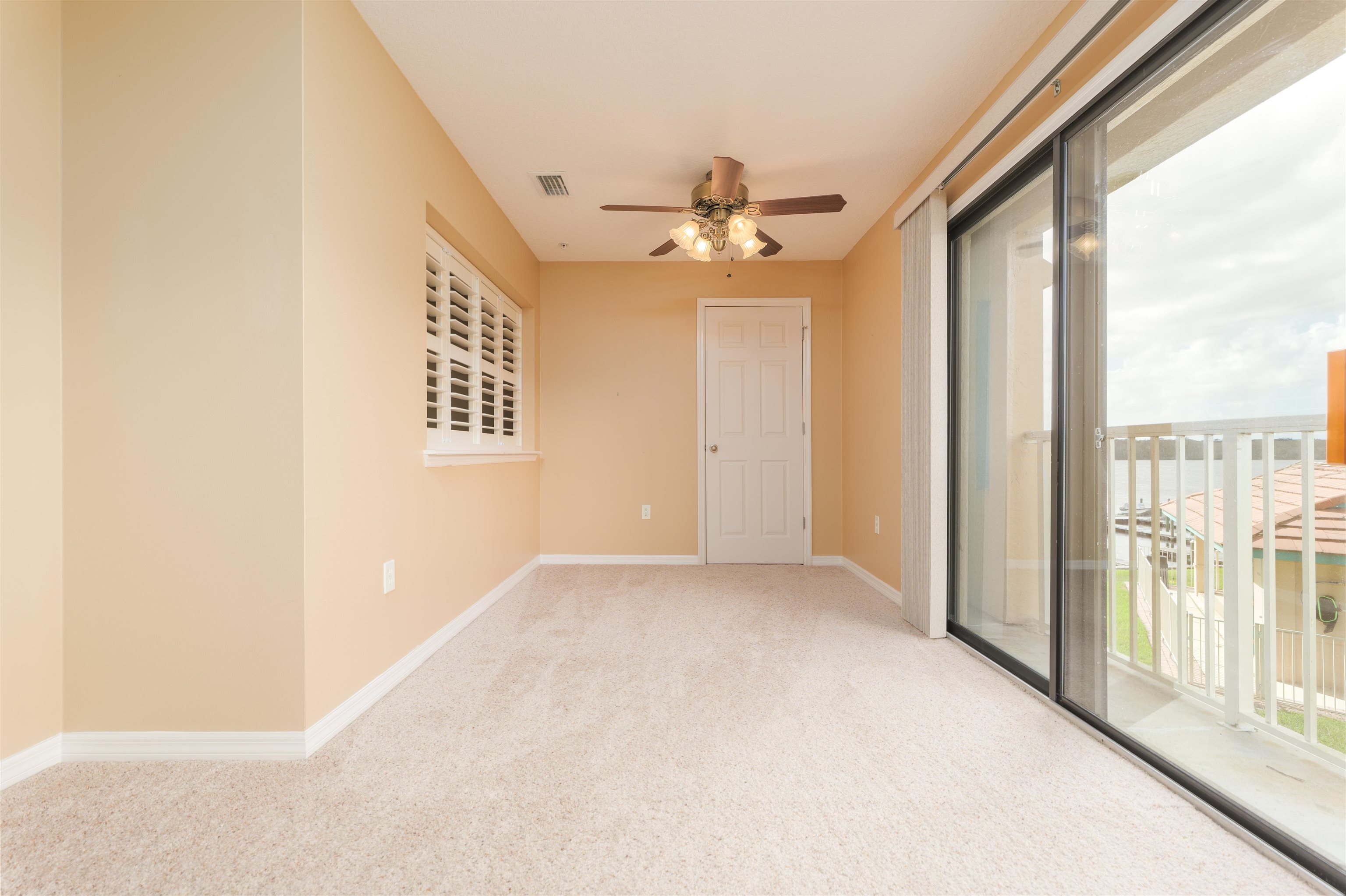 99 Broad River Place, Unit 3205 Welaka, FL 32193 - Photo 17 of 33 a view of a big room with windows and chandelier fan