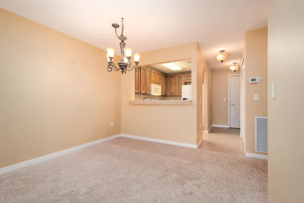 a view of a chandelier in hallway