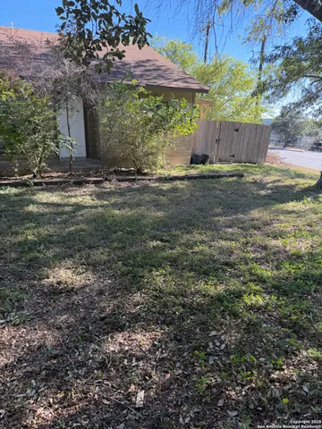 a view of a yard with an outdoor space