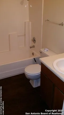 a bathroom with a sink a toilet and a bathtub