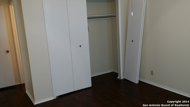 12200 Ridge Crown Street San Antonio, TX 78247 - Photo 6 of 20 a view of front door with wooden floor