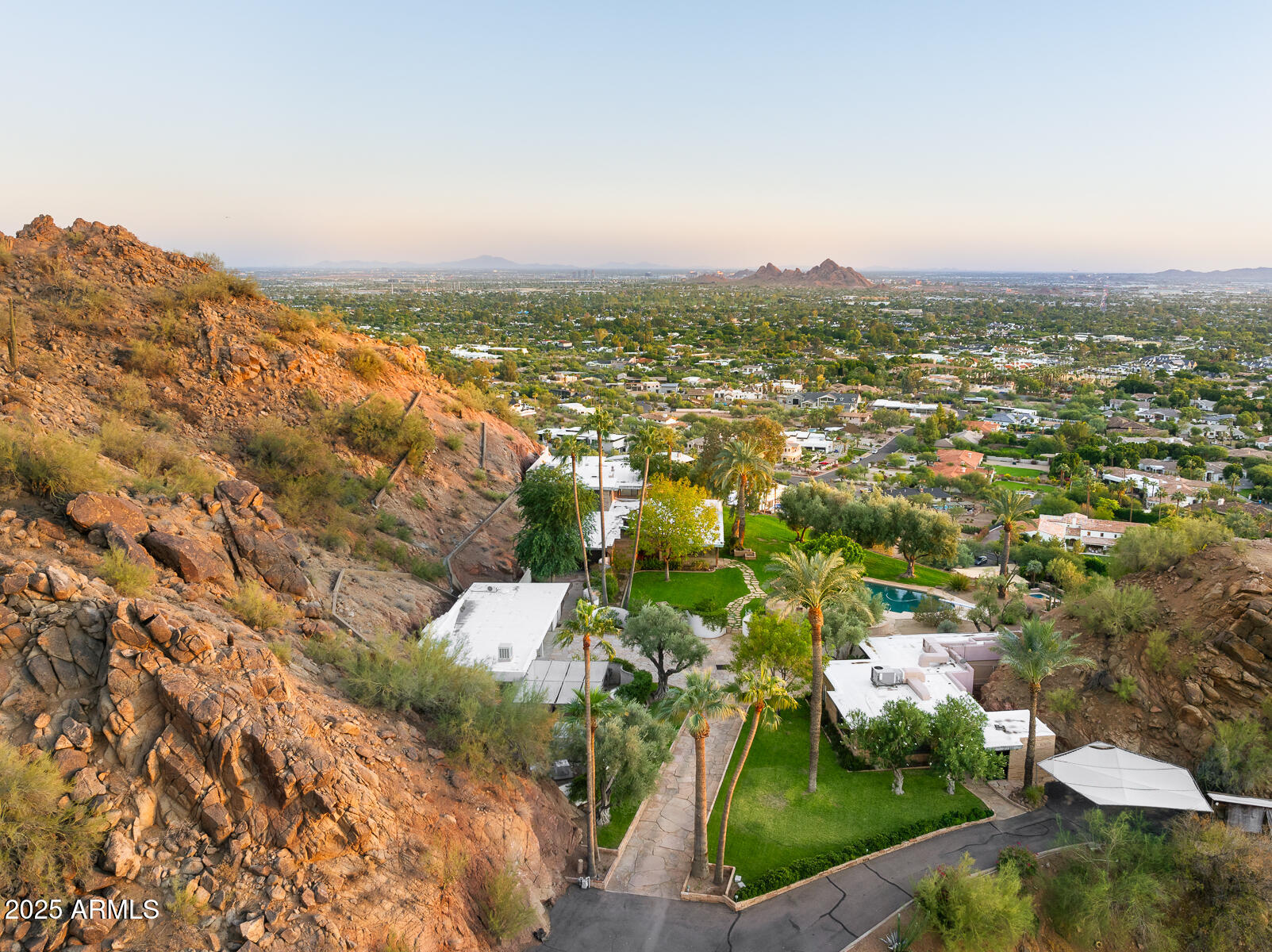 5500 North Dromedary Road, Unit V Phoenix, AZ 85251 - Photo 11 of 26 an aerial view of residential houses with outdoor space