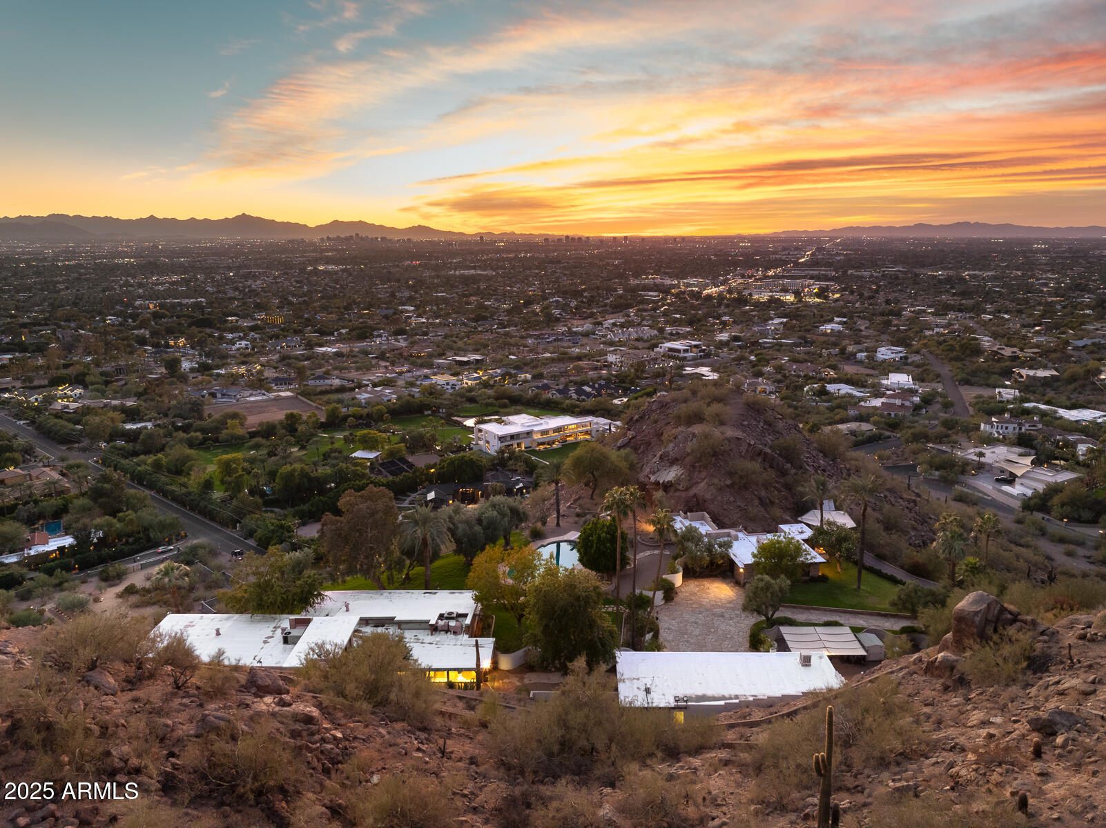5500 North Dromedary Road, Unit V Phoenix, AZ 85251 - Photo 21 of 26 an aerial view of residential houses with outdoor space
