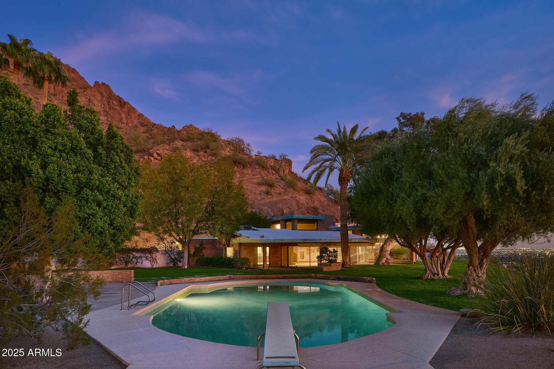 5500 North Dromedary Road, Unit V Phoenix, AZ 85251 - Photo 7 of 26 a view of a street with a building in the background