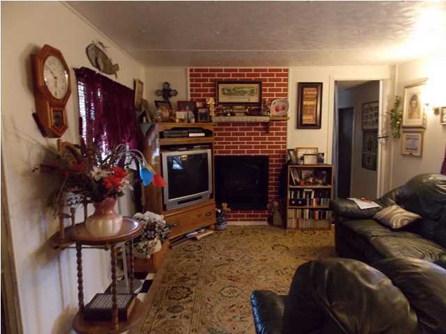 731 Paul Road DeFuniak Springs, FL 32433 - Photo 2 of 14 a living room with furniture a dining table a rug and a window