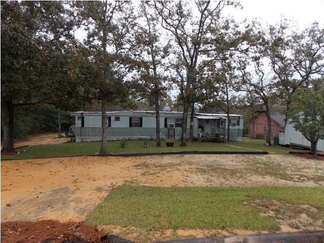 731 Paul Road DeFuniak Springs, FL 32433 - Photo 5 of 14 a front view of a house with a yard