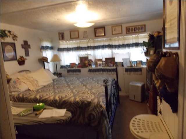 731 Paul Road DeFuniak Springs, FL 32433 - Photo 7 of 14 a living room with furniture and a fireplace