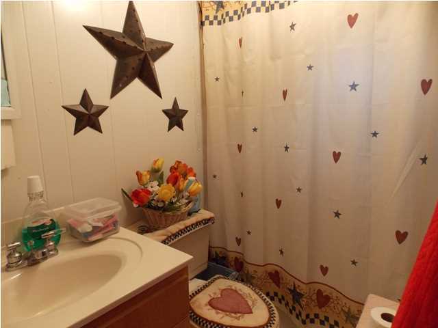 731 Paul Road DeFuniak Springs, FL 32433 - Photo 9 of 14 a bathroom with a sink toilet and a mirror