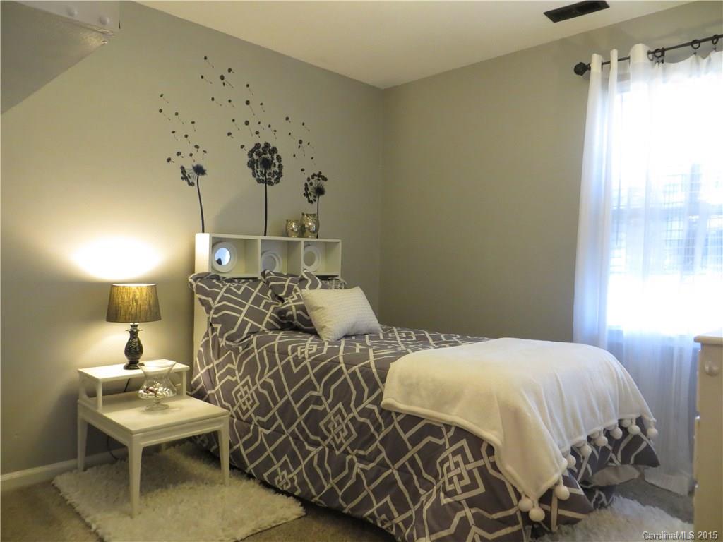 732 Ike Lynch Road Dallas, NC 28034 - Photo 11 of 24 a bedroom with a bed and a table