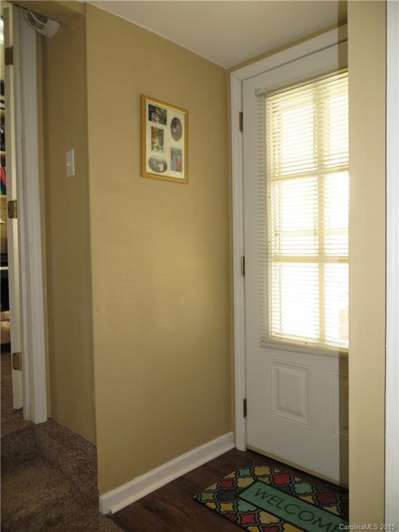 732 Ike Lynch Road Dallas, NC 28034 - Photo 15 of 24 a view of an empty room with wooden floor and a window