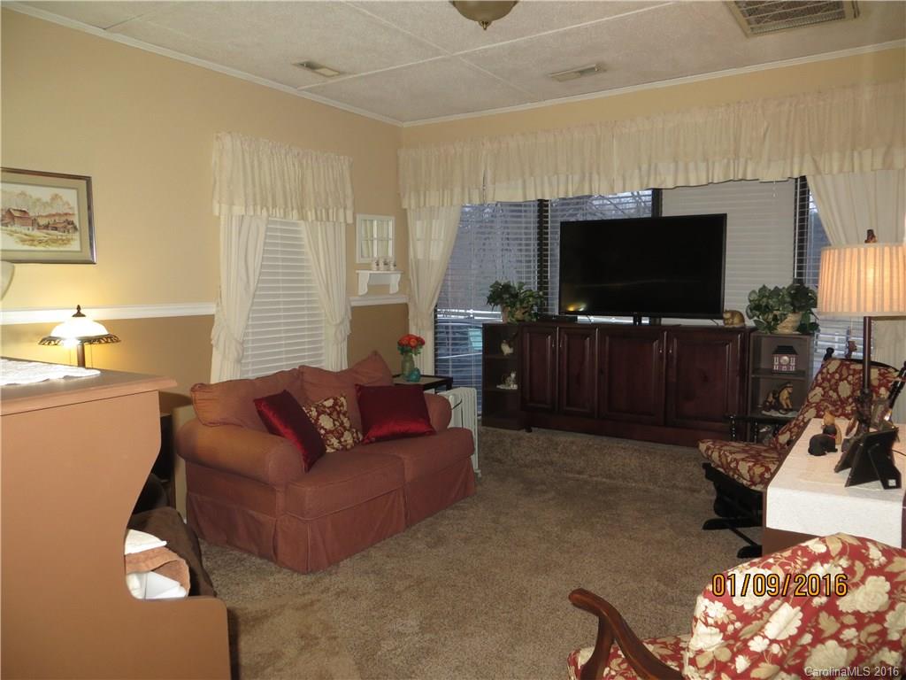 732 Ike Lynch Road Dallas, NC 28034 - Photo 16 of 24 a living room with furniture and a flat screen tv