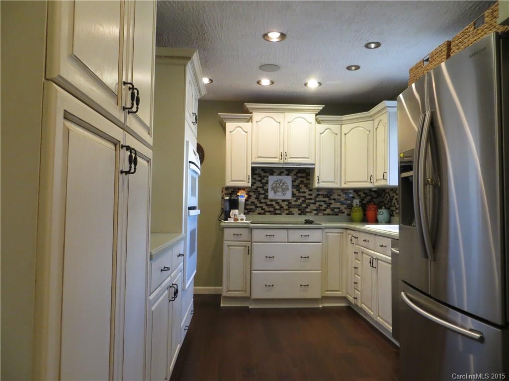 732 Ike Lynch Road Dallas, NC 28034 - Photo 5 of 24 a kitchen with stainless steel appliances a refrigerator sink and cabinets