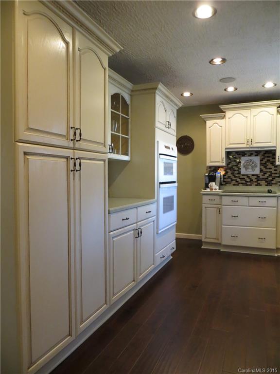 732 Ike Lynch Road Dallas, NC 28034 - Photo 6 of 24 a kitchen with stainless steel appliances granite countertop a refrigerator and a stove top oven