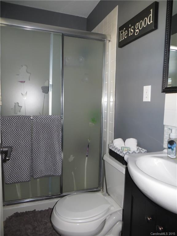 732 Ike Lynch Road Dallas, NC 28034 - Photo 10 of 24 a bathroom with a sink a toilet and shower