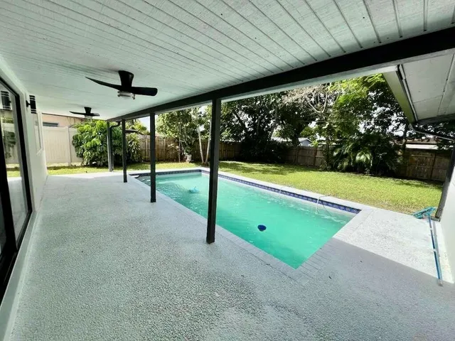a view of a room with porch and wooden floor