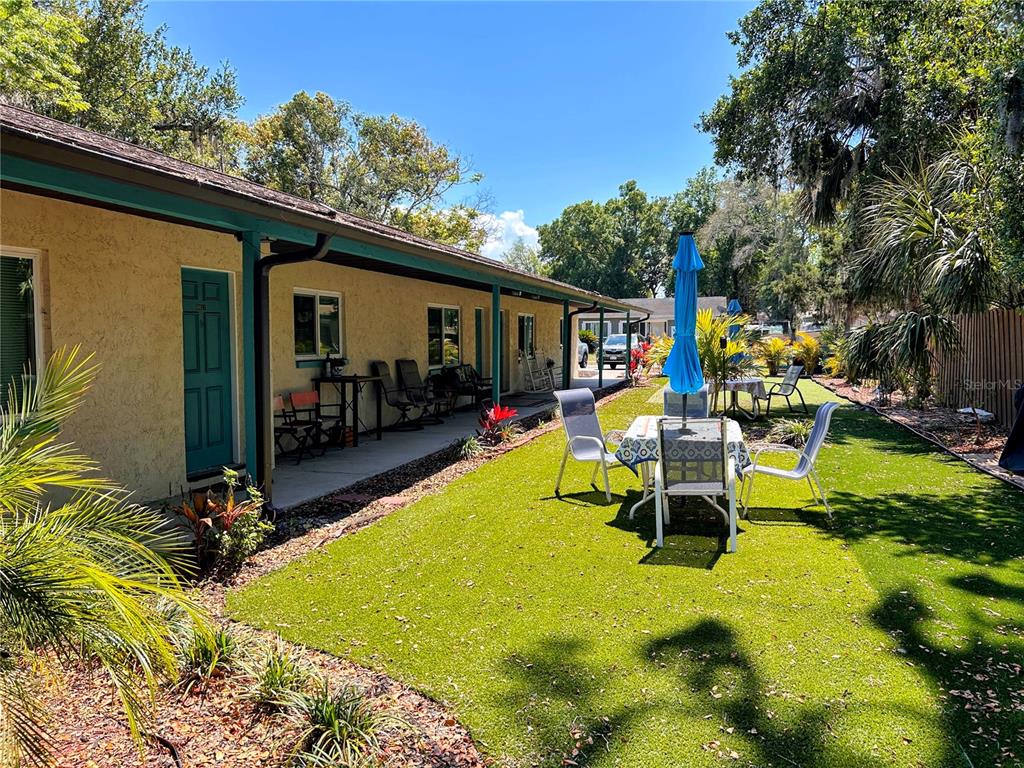 6029 Wyoming Avenue New Port Richey, FL 34653 - Photo 1 of 14 a view of a swimming pool with chairs