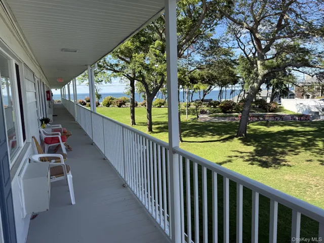 a view of a balcony with trees