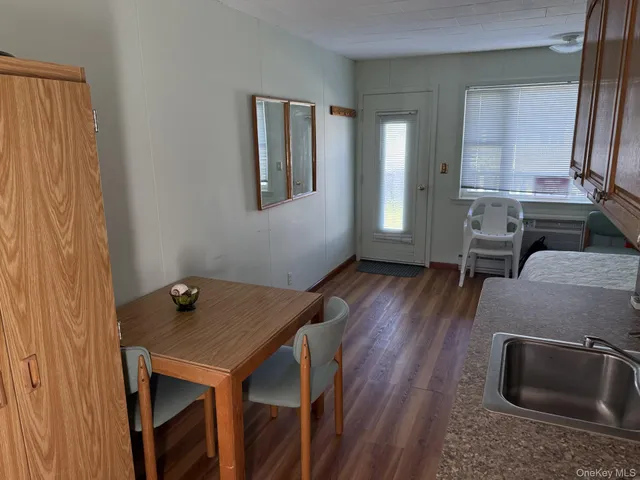 a view of a livingroom with furniture and wooden floor