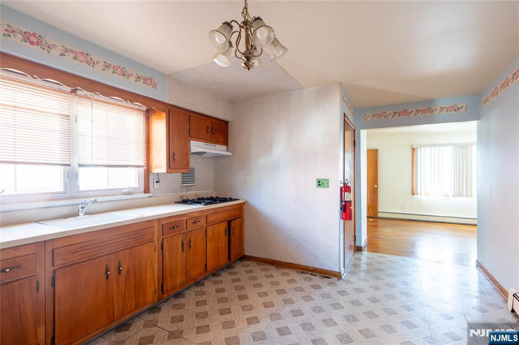 24 Mahar Avenue Clifton, NJ 07011 - Photo 12 of 20 a view of a kitchen with a sink and windows