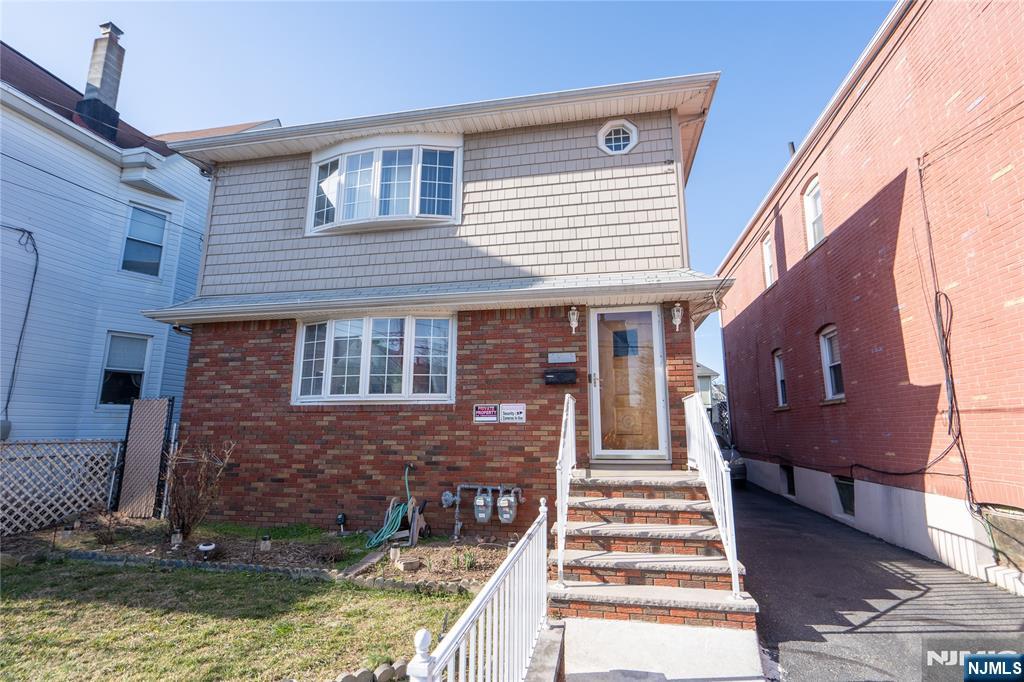 24 Mahar Avenue Clifton, NJ 07011 - Photo 2 of 20 a front view of a house with a yard