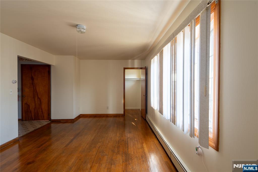 24 Mahar Avenue Clifton, NJ 07011 - Photo 3 of 20 a view of a room with wooden floor and windows
