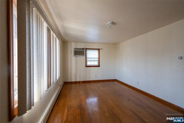 a view of an empty room and glass door