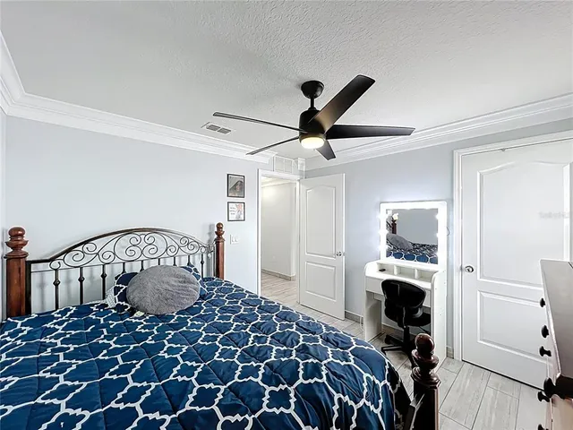 a bedroom with a bed and a dresser